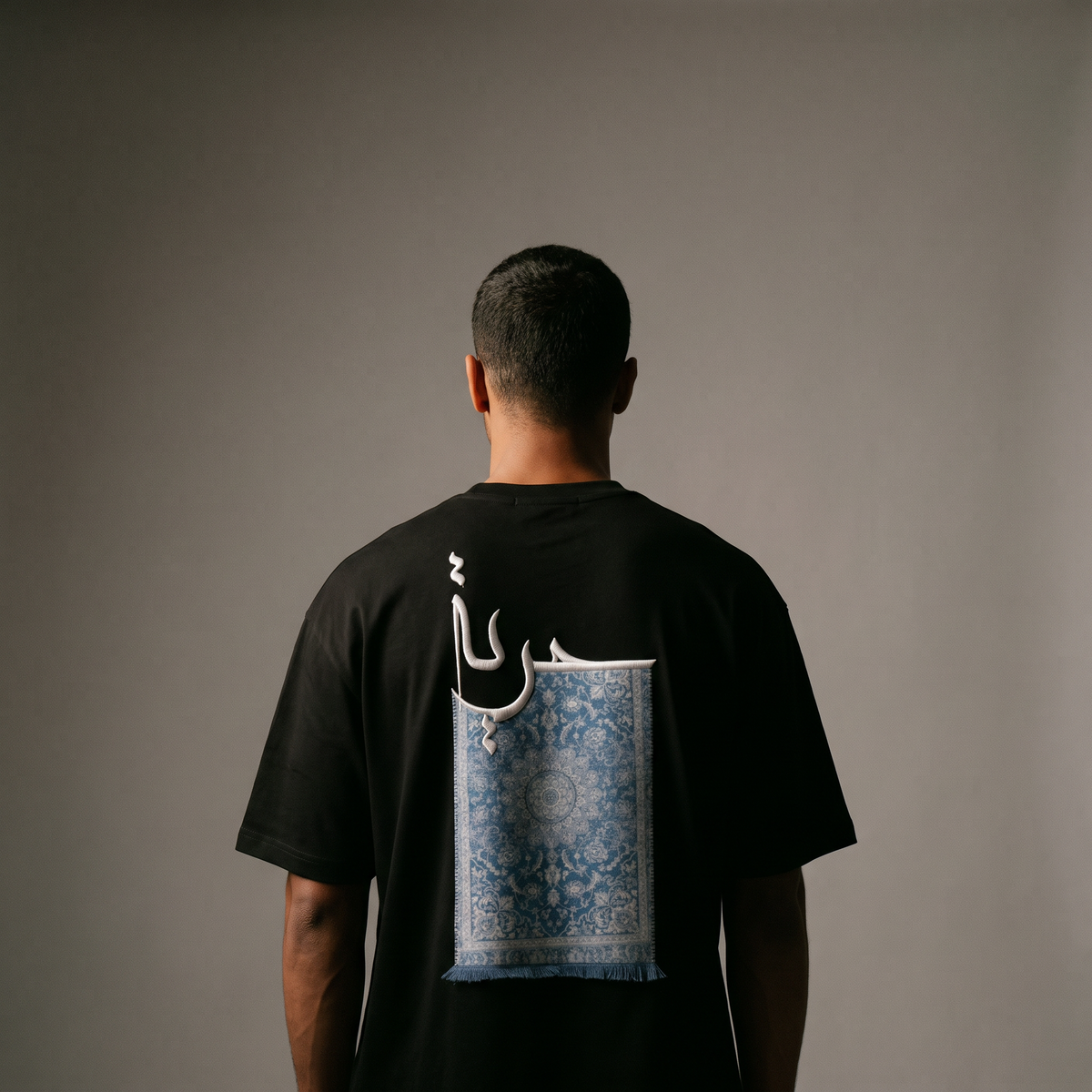7AAL Man Hurriyya Tee in black, oversized embroidered heavyweight t-shirt, back view