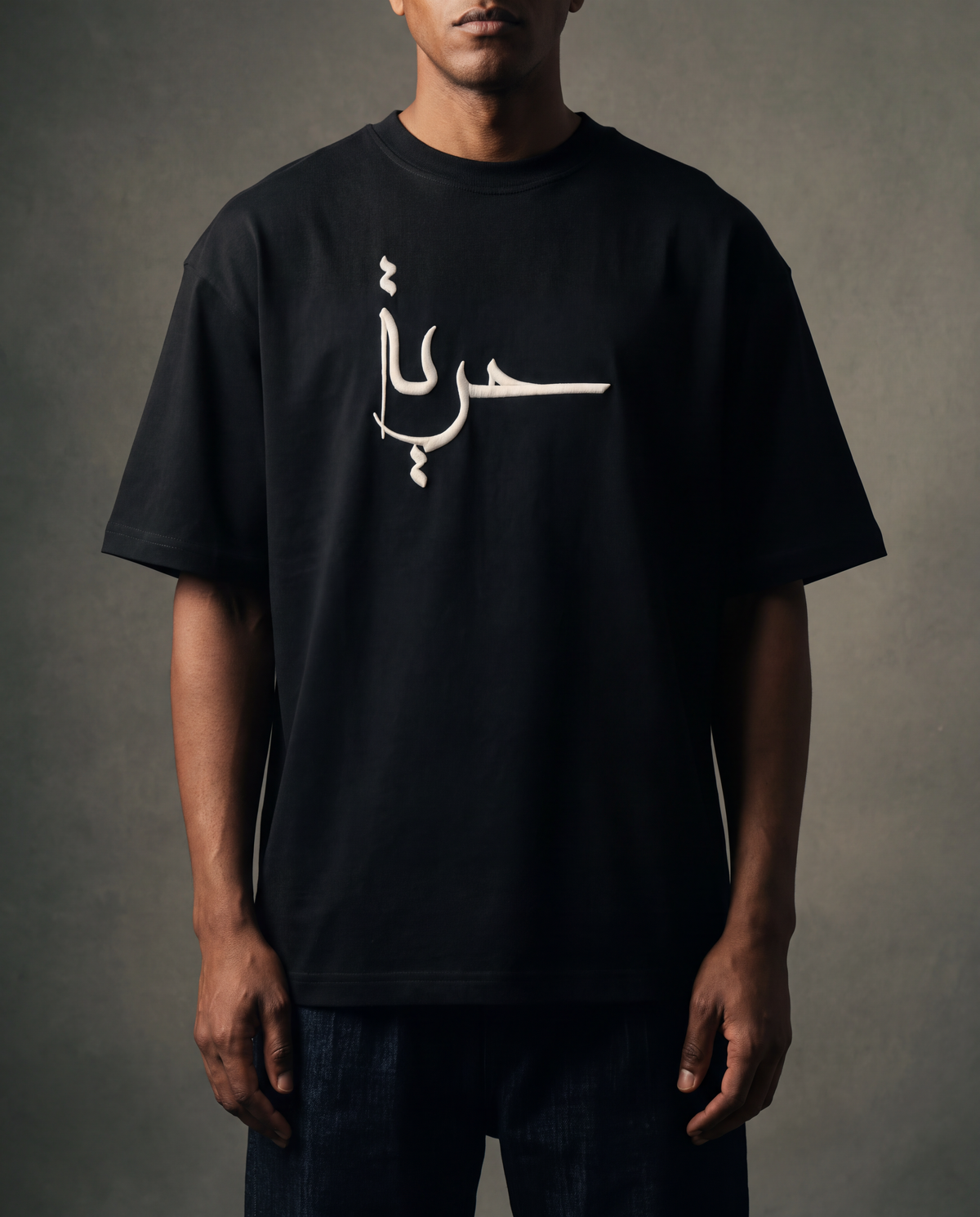 7AAL Man Hurriyya Tee in black, oversized embroidered heavyweight t-shirt, front view