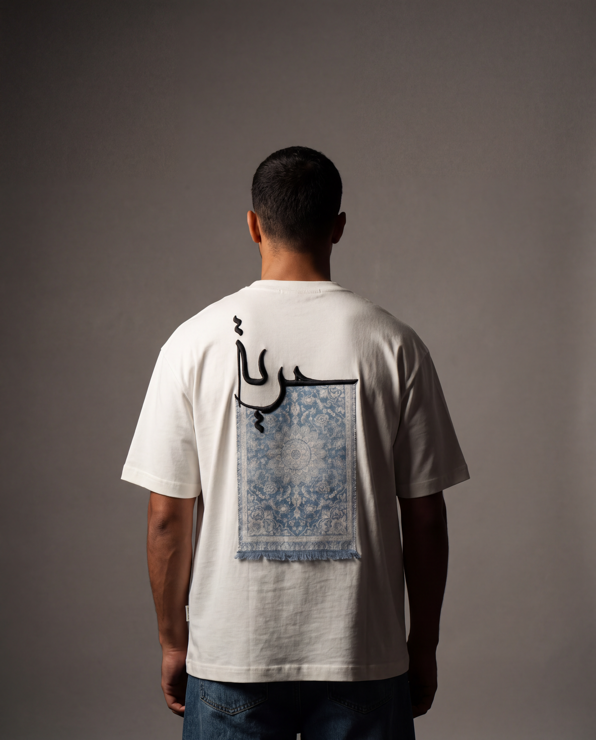 7AAL Man Hurriyya Tee in white, oversized embroidered heavyweight t-shirt, back view