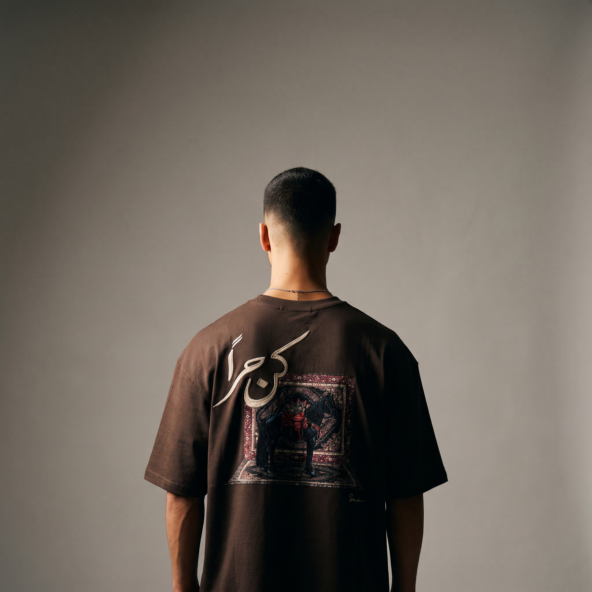 7AAL Man Kun Hurran Tee in brown, oversized embroidered heavyweight t-shirt, back view