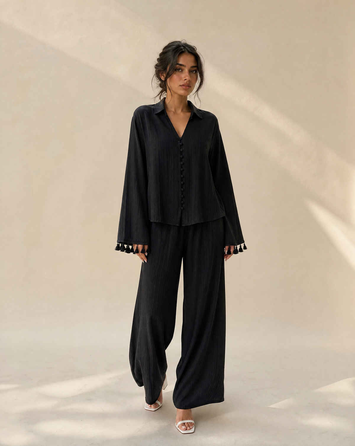 7AAL The Sienna Set, black co-ord set with tassel cuffs, full-length view