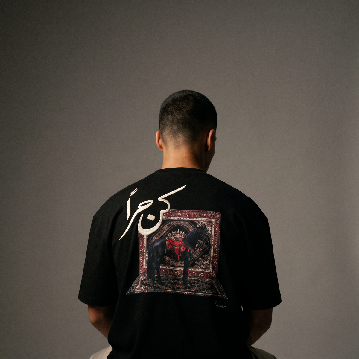 7AAL Man Kun Hurran Tee in black, oversized embroidered heavyweight t-shirt, back view